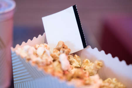 Movie tickets with popcorn snack. Home theatre movie or series night concept