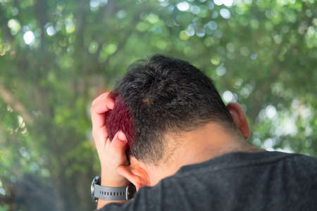 Young man are stressed and hand holding head with headache. Stress and frustration concept.の写真素材