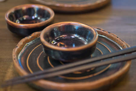 Empty plate, bowl and chopsticks in Japan restaurantの写真素材