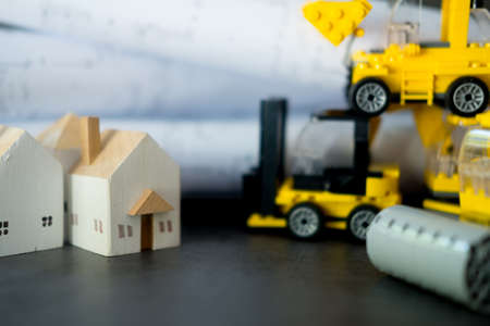 Miniature wood home with toys transport construction. Construction site conceptの写真素材