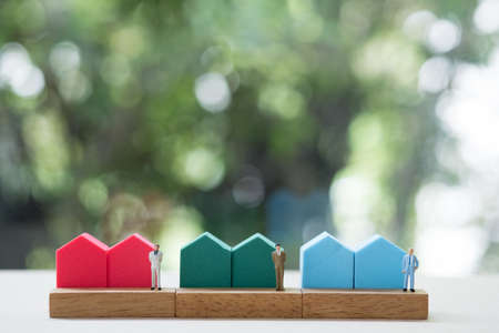 Miniature people agent sell home. Concept of the financial loans and concept of agent for sell home