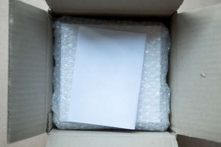 Parcel in brown box with for protection parcel product cracked or insurance during transit in brown boxの写真素材