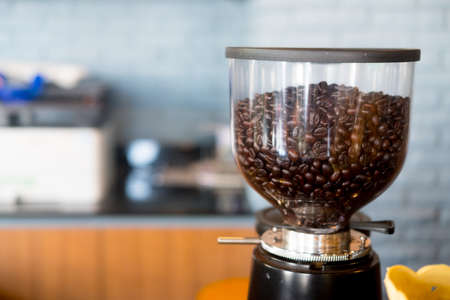 Automatic professional coffee maker and coffee grinder in a cafe. Coffee beansの写真素材