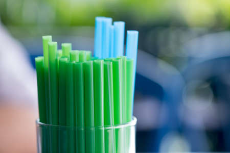 Drinking straws for party against on blur backgroundの写真素材