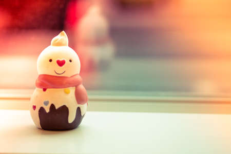 Ceramic toy snowman for decoration in home. Happy Santa Claus Doll on Christmas timeの写真素材