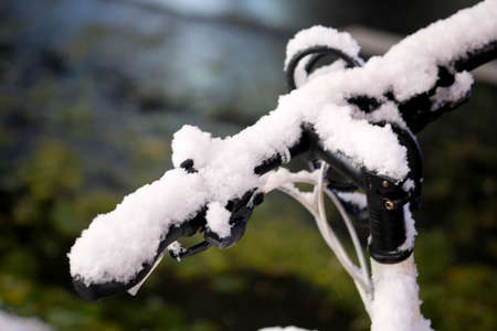 Cloesup of a bike handle covered with snowの写真素材
