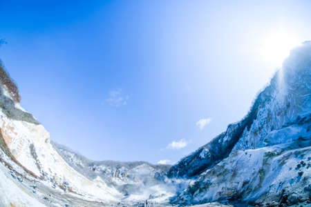 Jigokudani or Hell Valley against blue sky in Noboribetsu Hokkaido Japanの写真素材