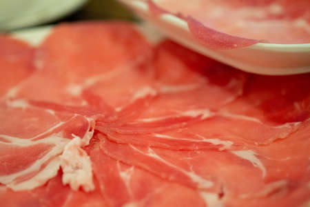 Fresh thin pork slices for Sukiyaki or grilledの写真素材
