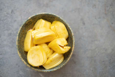Fresh jackfruit slices in bowl. Sweet yellow jackfruit ripe. Exotic tropical fruit