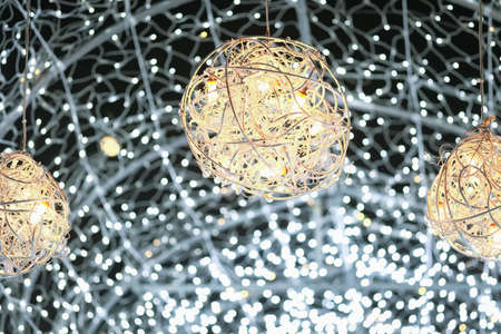 Street decorated for New Year and Christmas holidays. Festival Christmas light. People enjoy...