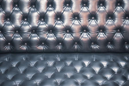 Luxury leather button-tufted black chair textureの写真素材