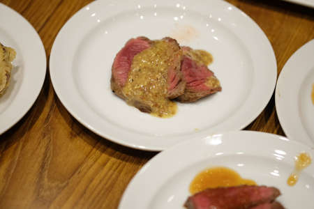 Premium grilled beef steak with sauce in the hotel restaurantの写真素材