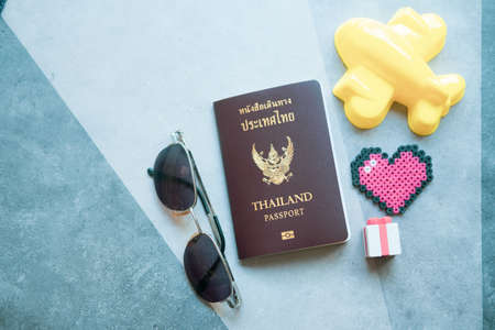 Flat lay image of Thailand passport and accessory to plan travel in holiday, Travel concept, Essential vacation itemsの写真素材