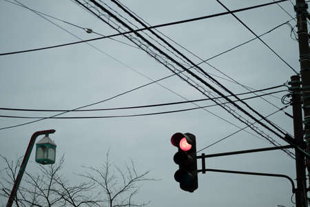 Traffic light close up with red signal. Traffic light on the background of sky in Hakodate,...