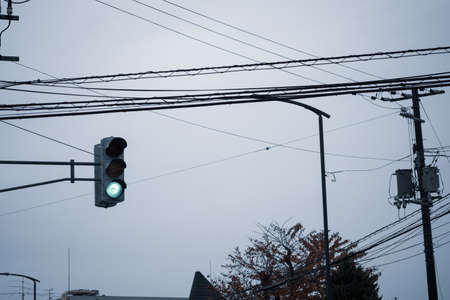 Traffic light close up with green signal. Traffic light on the background of sky in Hakodate, Hokkaido.の写真素材