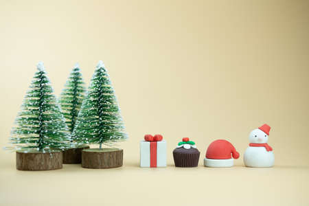 Christmas and New Year toy on yellow background. Holiday card with copy spaceの写真素材