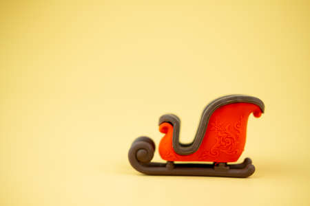Sleigh of Santa Claus on yellow background. Transport of Christmas holiday