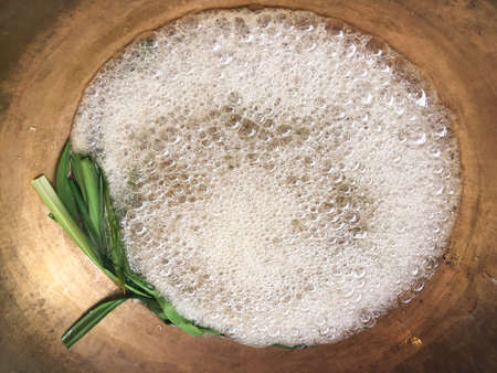 Thai chef boil sugar syrup for making ancient Thai dessert