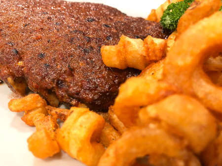 Barbecue pork spare ribs with sauce and chip. Close up