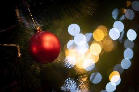 Close up of beautiful Christmas decoration- bauble Christmas red ball hanging on the Christmas tree