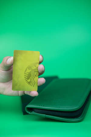 Bangkok, Thailand - January 5, 2020 : Green passport bag form Starbucks coffee shop a gift exclusive...
