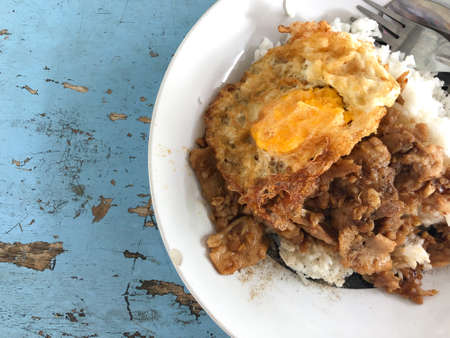 Steam rice with fried egg and stir-fried pork with garlic,Thai food.