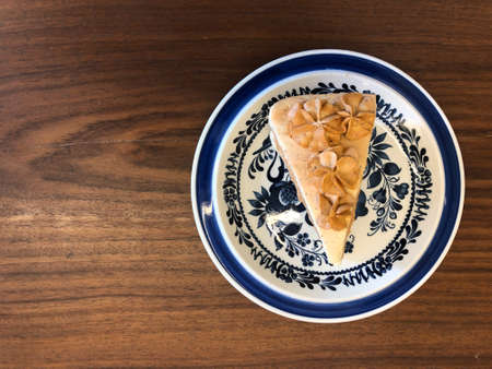 Thai tea cake on Thai style ceramic plate put on wood tableの写真素材