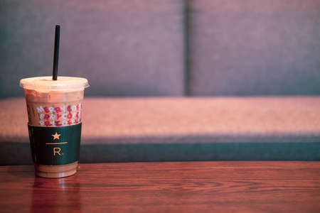 BANGKOK, THAILAND - January 1, 2020 : Starbucks coffee cold beverage in transparent plastic cup on...