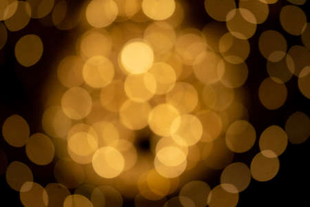 Orange bokeh lights background for design