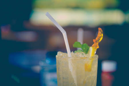 Lemonade or mojito cocktail with lemon and mint. Cold refreshing drink or beverage with iceの写真素材