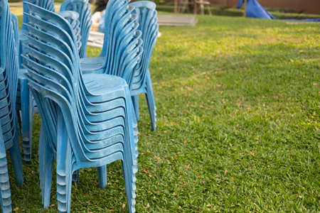 Stack of blue plastic chair prepare for the eventの写真素材