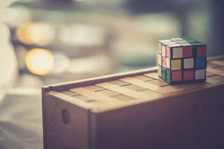 Generic puzzle cube put on wood block puzzleのeditorial素材