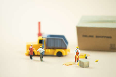 Miniature people : Worker team moving order from online shopping. Concepts of logistics and transportationの写真素材
