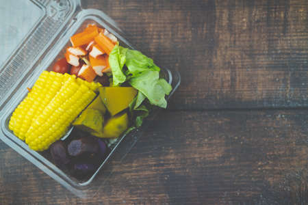 Salad with mixed fruits and vegetable in plastic box. Healthy lifestyle conceptの写真素材