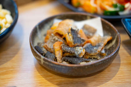 Crispy baked and seasoned salmon skin in bowl