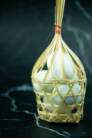 Salted egg is delicious in wicker round bamboo basket you can gift for friend. Concept of Thai agricultural productsの写真素材