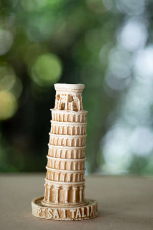 Leaning Tower of Pisa souvenir from Italy on wood table
