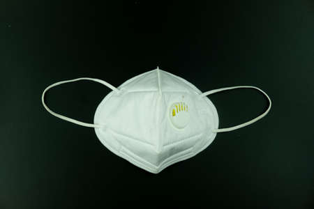 Safety breathing masks. Industrial safety N95 mask, dust protection respirator and breathing medical respiratory mask on dark backgroundの写真素材