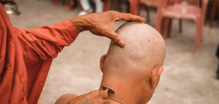 Male who will be monk shaving hair for be Ordained to new monk, Buddhist Ordination
