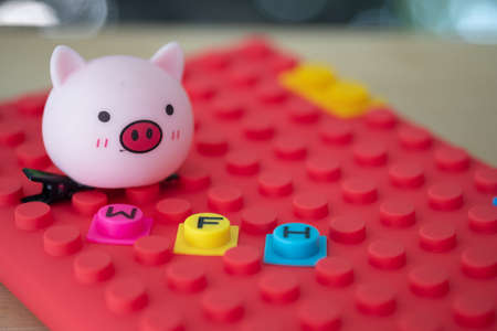 WFH (WORK FROM HOME) and toy cute pig it mean easy to work form homeの写真素材