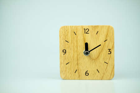 Table wooden clock square shape on front view. Close upの写真素材