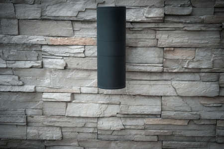 Close up of black LED downlight decoration in brick wall decoration at gardenの写真素材