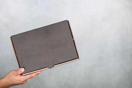 Man holding cardboard boxes. Fast and free delivery transport. online shopping and express delivery.