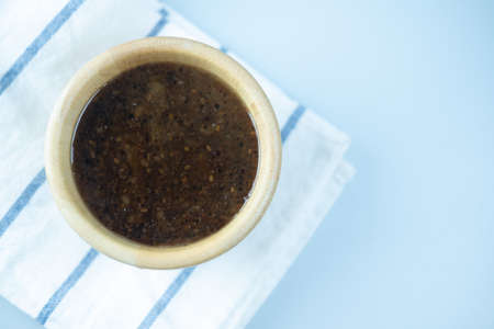 Close up of Japanese sesame salad dressing sauce in wood bowlの写真素材