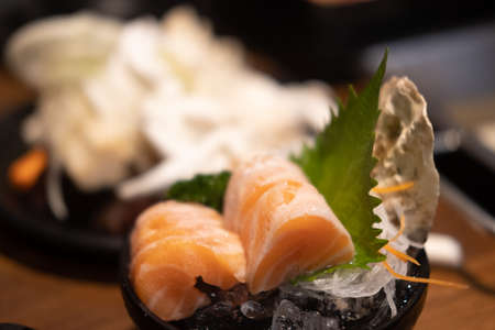 Raw salmon slice or salmon sashimi serve on iceの写真素材