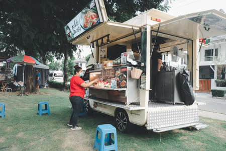 Samut Prakan, Thailand - April 26 2020 : People enjoy eating food from Theâ food shop in a food truck style that parkingâ andâ selling someâ foodのeditorial素材