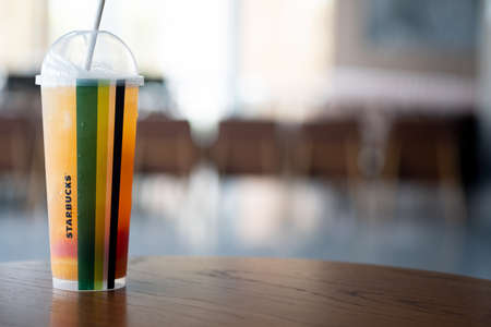 Samut Prakan, Thailand - April 26 2020 : New beverages remixed and all so fruity, flavorful and refreshing. Tropical triple citrus green tea mixed with of three orange juices topped with grapefruit, lemon and oranges slices.のeditorial素材