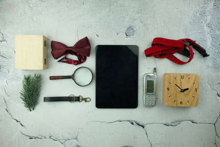Men accessories and tablet on Cracked cement background. Flat Lay background