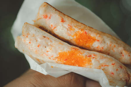 Grilled sandwich stuffed with mayonnaise mix with shrimp egg for breakfastの写真素材