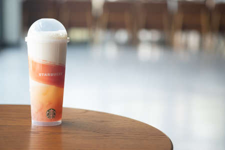 Samut Prakan, Thailand - April 30 2020 : New beverage drink all summer long. Peach Cloud with Jelly A combination of white peach juice, green tea, peach jellys topped with velvety white peach cold foam for a sweetのeditorial素材